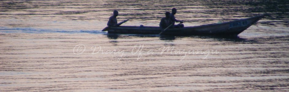 Fishermen in dugout canoe on the Kazinga Channel