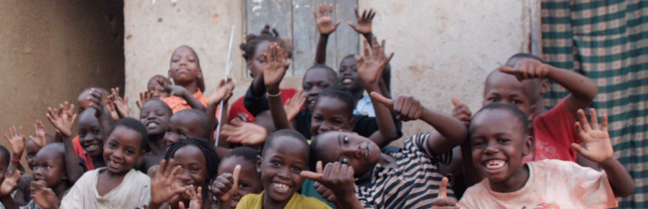 Happy children posing for the camera in Namuwongo slum