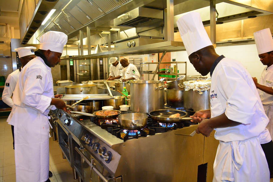 Competing chefs hard at work in the kitchens of the Kigali Marriott Hotel during the Gorilla Highlands Silverchef Competition 2018. PHOTO Vincent Mugaba