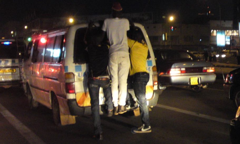 boys joy riding matatu Kampala