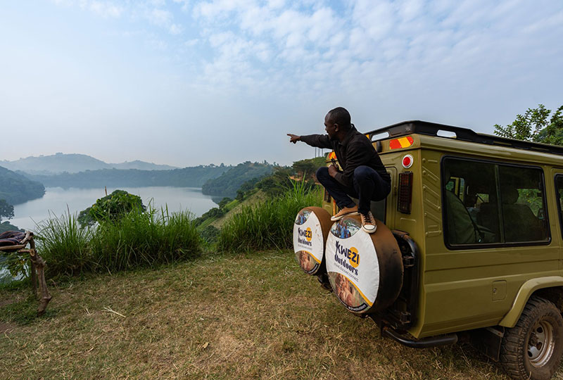 Kwezi-Outdoors-guide-in-field. Uganda tours