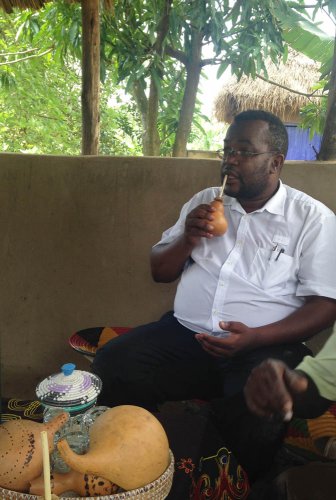 Agartha's Taste of Uganda, Ishasha. Arthur enjoys millet porridge