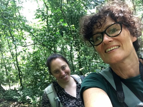 Charlotte-and-Cathy,-chimp-tracking-Kibale-Forest