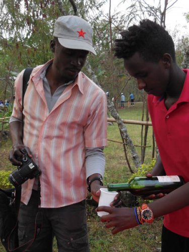 Solomon Oleny tries local wine. Red Rocks, Musanze, Rwanda