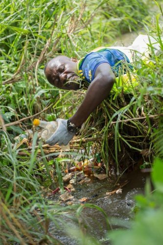 Kateeba Mark of Fort Portal clears River Mpanga of plastics during cleaning campaign - Afriyea
